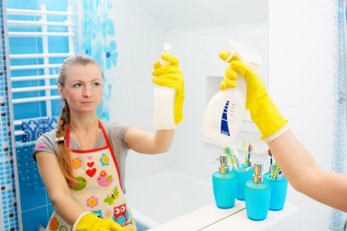 Professional cleaners working in a Barnes home with care and attention