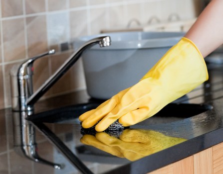 Professional house cleaner working in a Barnes family home